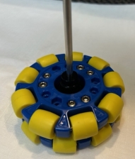A blue and yellow plastic object with a screwdriver

Description automatically generated