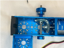 A blue metal device with gears

Description automatically generated
