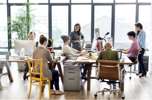 A group of people sitting around a table

Description automatically generated with medium confidence