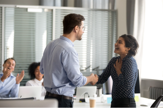 A person shaking hands with a person

Description automatically generated with low confidence